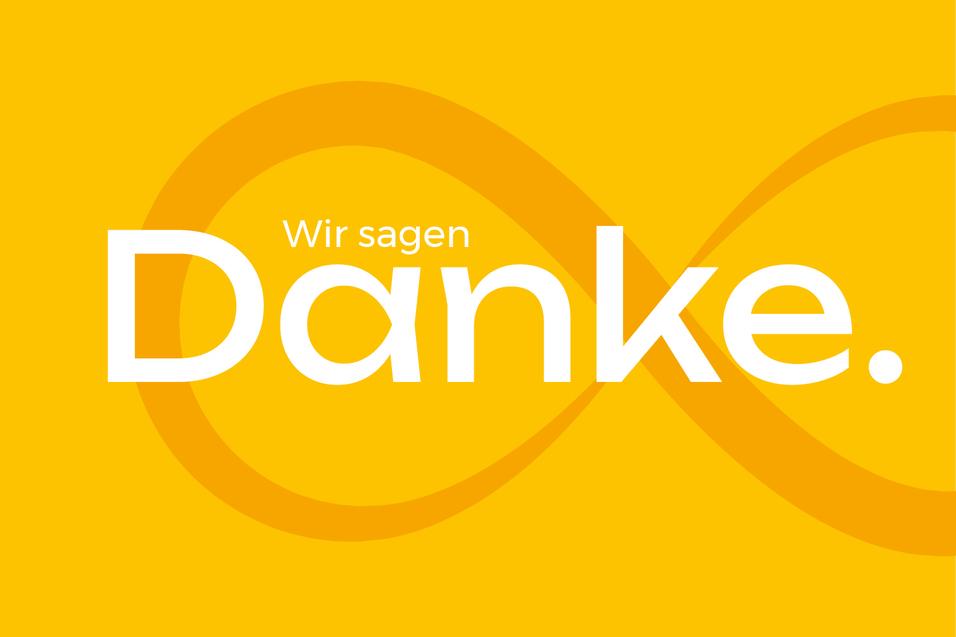 Gelbes Hintergrundbild mit dem Text „Wir sagen Danke.“ in großen, weißen Buchstaben.